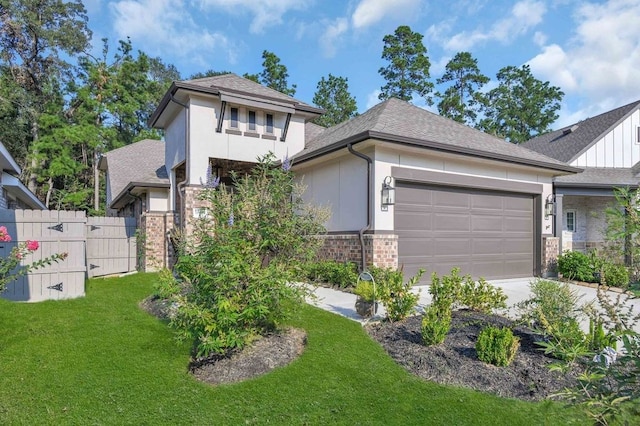 view of front of property with a garage and a front yard