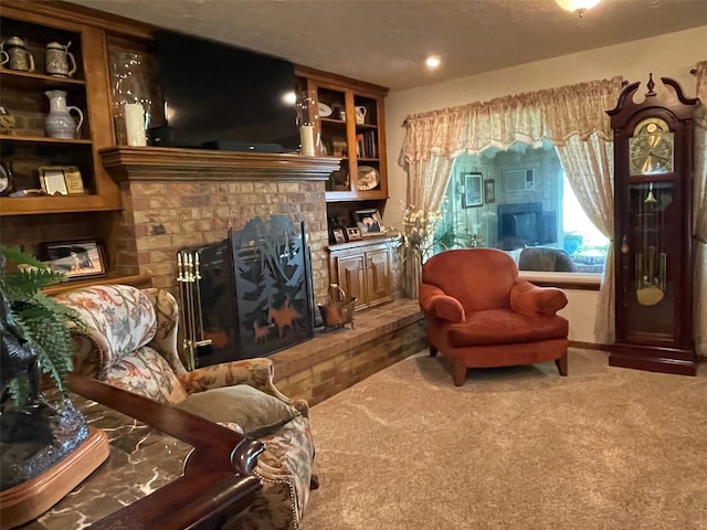 carpeted living room featuring built in shelves and a brick fireplace