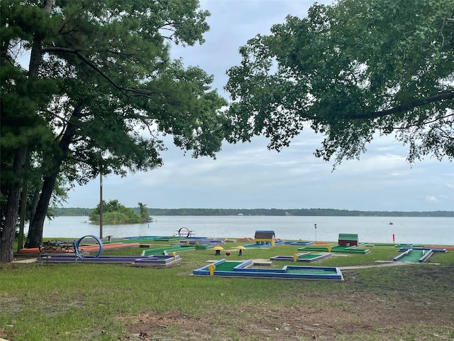 surrounding community featuring a water view