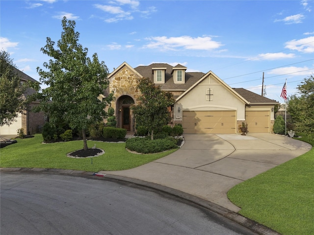 view of front of property with a garage and a front yard