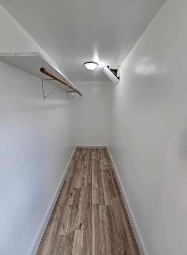 spacious closet with light wood-type flooring