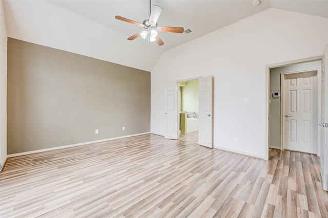 unfurnished bedroom with lofted ceiling, ensuite bath, ceiling fan, and light hardwood / wood-style floors