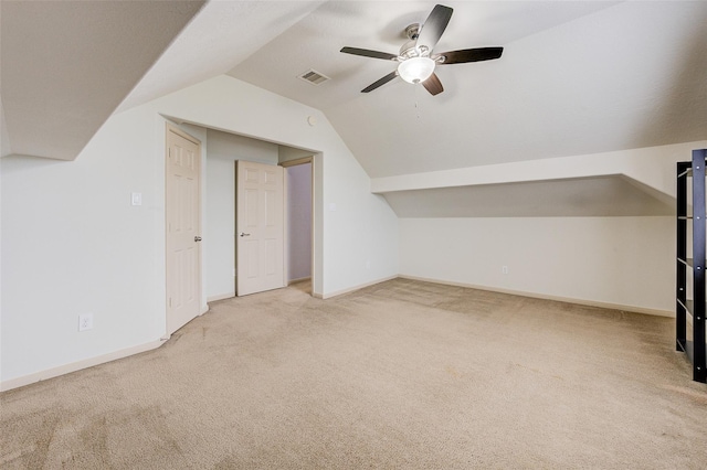 bonus room featuring ceiling fan, light colored carpet, and vaulted ceiling