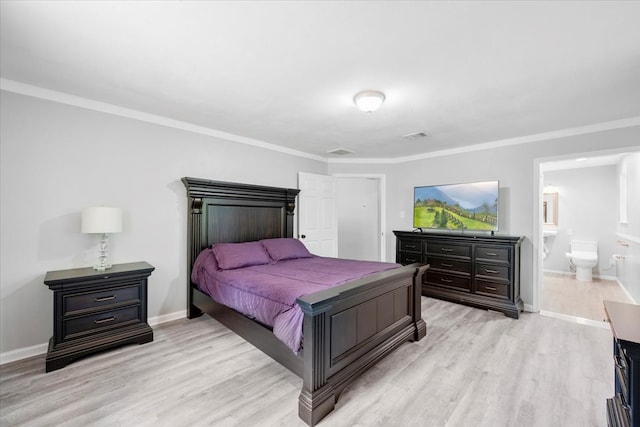 bedroom with ensuite bath, crown molding, and light wood-type flooring