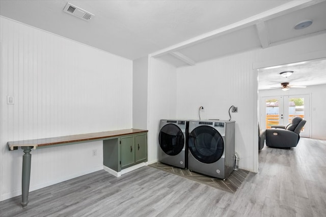 clothes washing area with separate washer and dryer, wood-type flooring, ceiling fan, and french doors