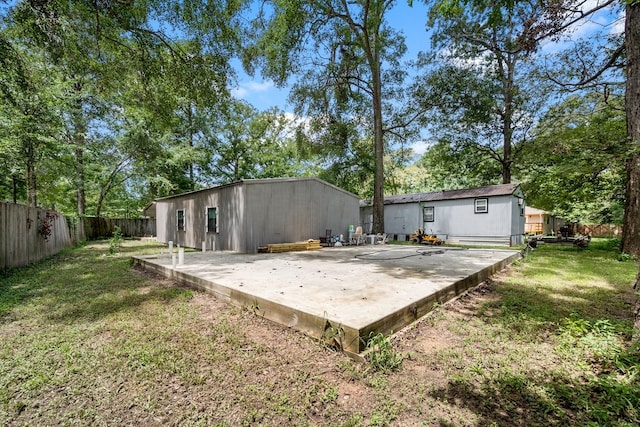 back of house with a lawn