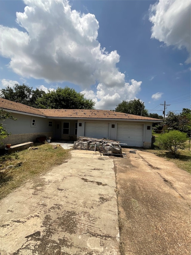 single story home with a garage