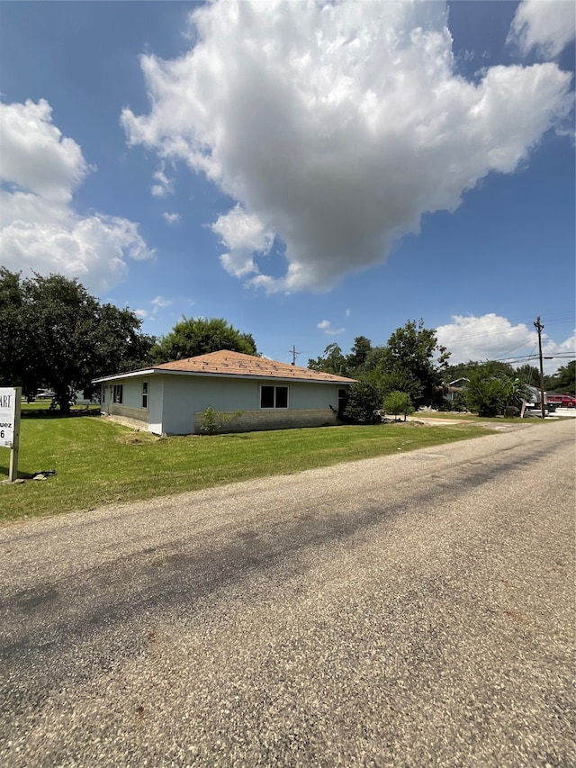 view of property exterior featuring a yard