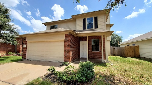 front of property with a garage and a front lawn