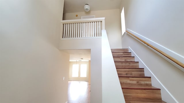 stairway featuring hardwood / wood-style floors