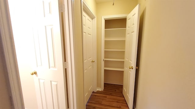 hallway featuring hardwood / wood-style flooring