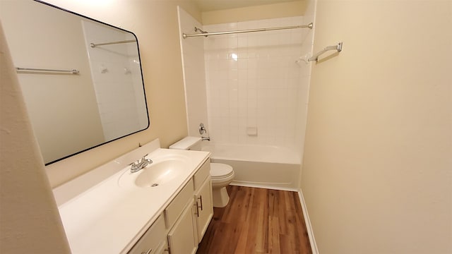 full bathroom with vanity, toilet, hardwood / wood-style floors, and tiled shower / bath