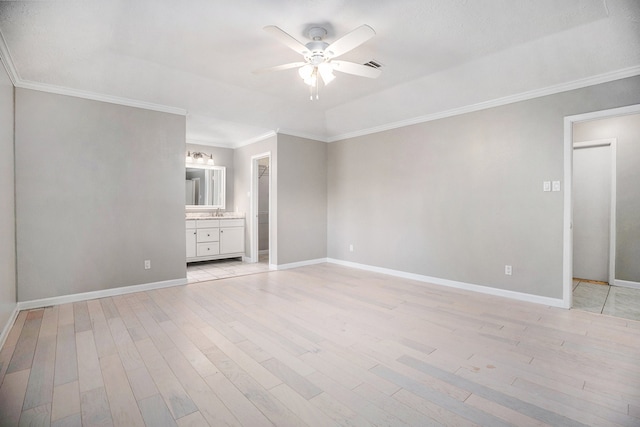 interior space featuring ceiling fan, light hardwood / wood-style floors, and ornamental molding