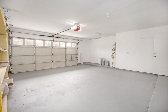 garage with water heater and a garage door opener