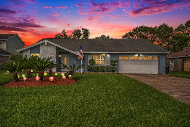 view of front of house with a lawn and a garage