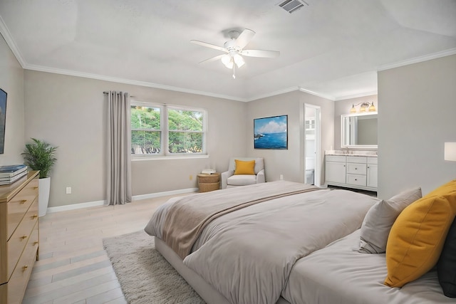 bedroom featuring light hardwood / wood-style floors, ensuite bath, ceiling fan, and ornamental molding