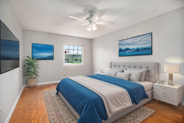 bedroom featuring ceiling fan and light hardwood / wood-style floors