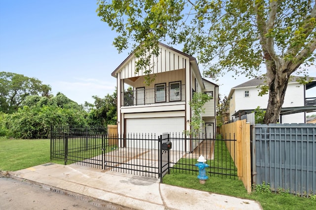 view of front of home featuring a balcony, a garage, and a front yard