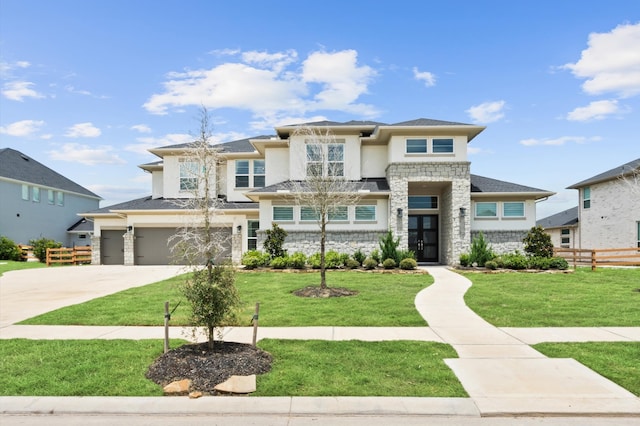 prairie-style home featuring a garage and a front yard