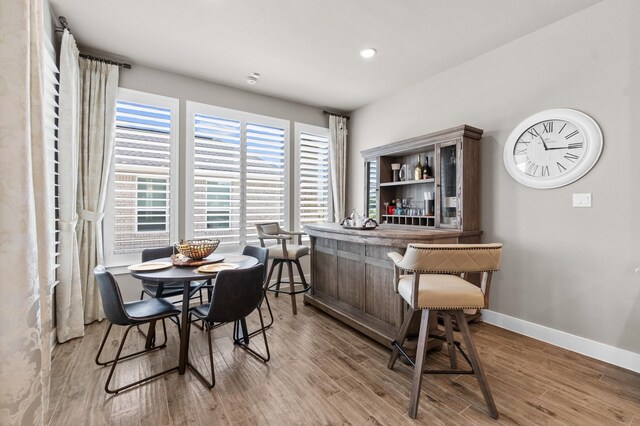 dining space featuring wood-type flooring