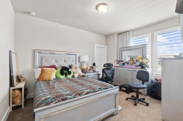 bedroom with light carpet