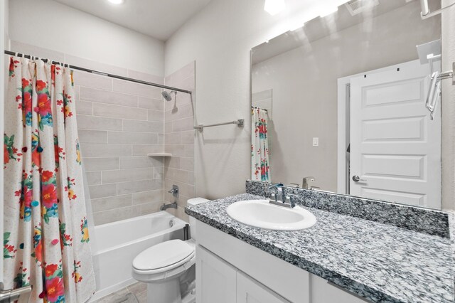 full bathroom featuring tile patterned floors, vanity, shower / bathtub combination with curtain, and toilet