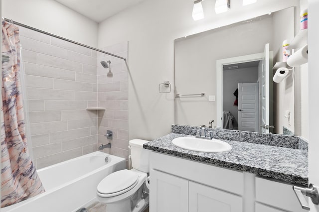 full bathroom with vanity, shower / bath combo with shower curtain, and toilet