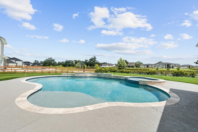 view of swimming pool featuring an in ground hot tub