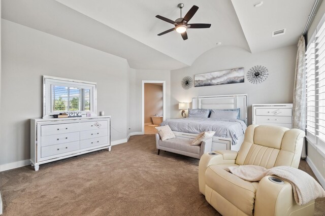 carpeted bedroom with lofted ceiling, ceiling fan, and connected bathroom