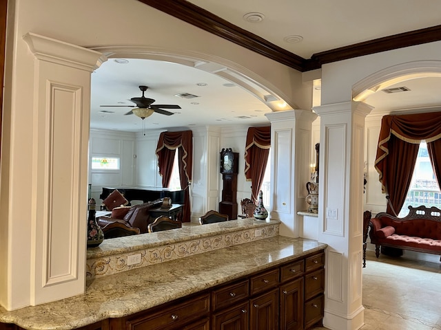 bathroom featuring tile patterned floors, ornamental molding, decorative columns, and ceiling fan