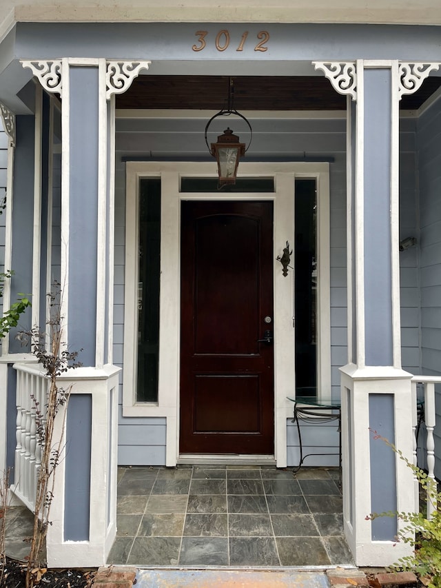 doorway to property featuring covered porch