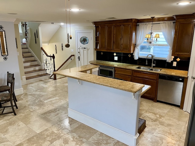 kitchen featuring stainless steel appliances, sink, hanging light fixtures, backsplash, and light tile patterned floors