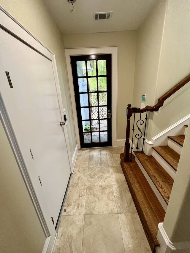 entryway featuring light tile patterned flooring