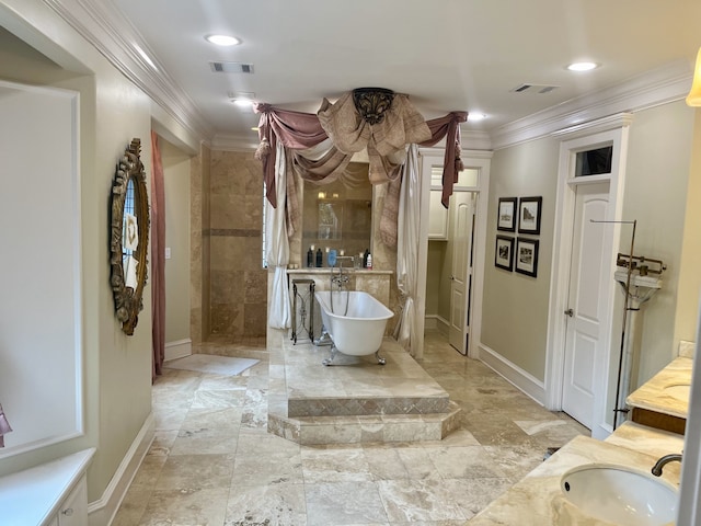 bathroom featuring vanity, crown molding, a bathtub, and tile patterned floors