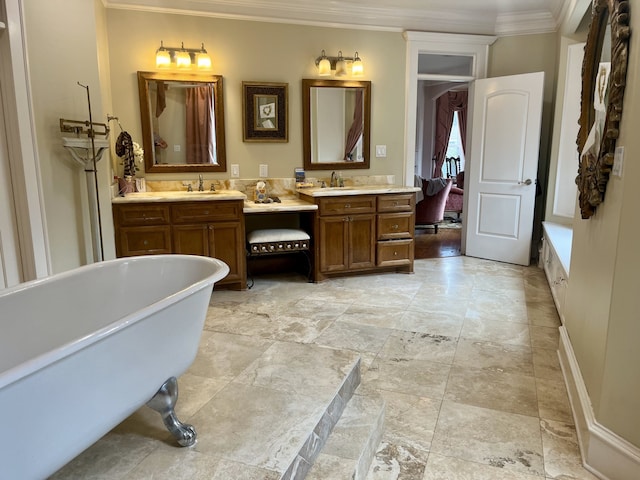 bathroom featuring a bathtub, crown molding, dual bowl vanity, and tile patterned flooring