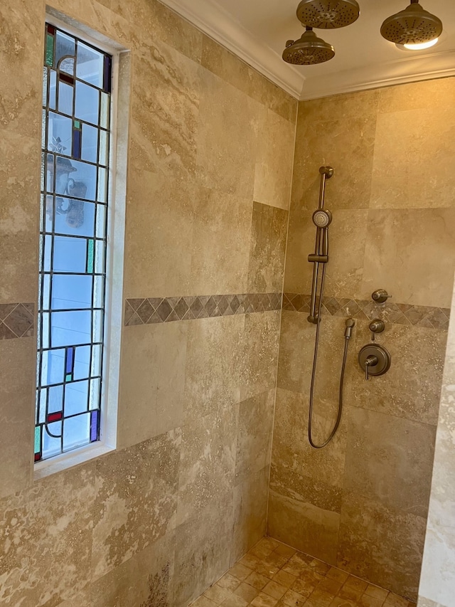 bathroom featuring tiled shower and ornamental molding