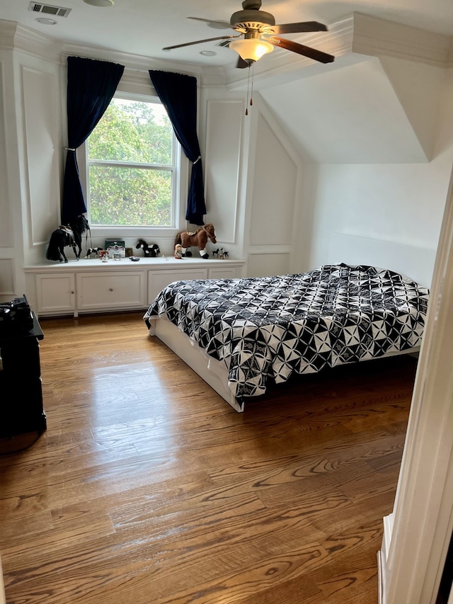 bedroom with light hardwood / wood-style flooring and ceiling fan