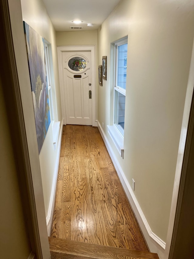 corridor featuring light hardwood / wood-style flooring