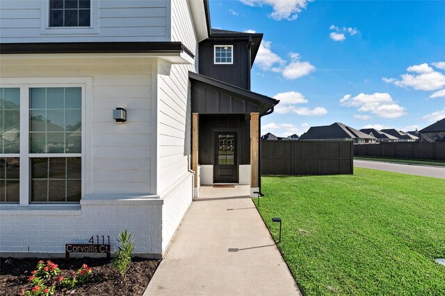 entrance to property with a yard