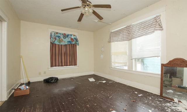 empty room featuring wood-type flooring and ceiling fan