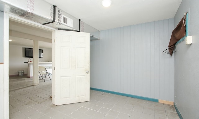 unfurnished room with light tile patterned floors