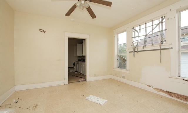 unfurnished room featuring ceiling fan