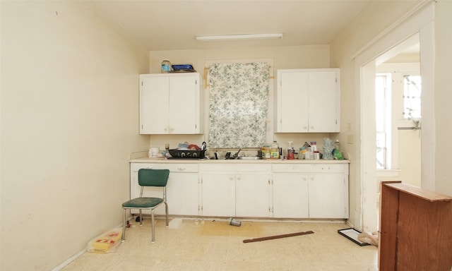 kitchen with sink and white cabinetry