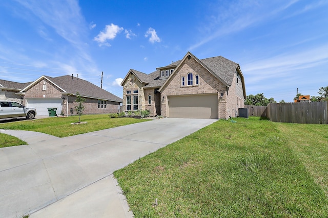 view of front facade with a garage and a front yard