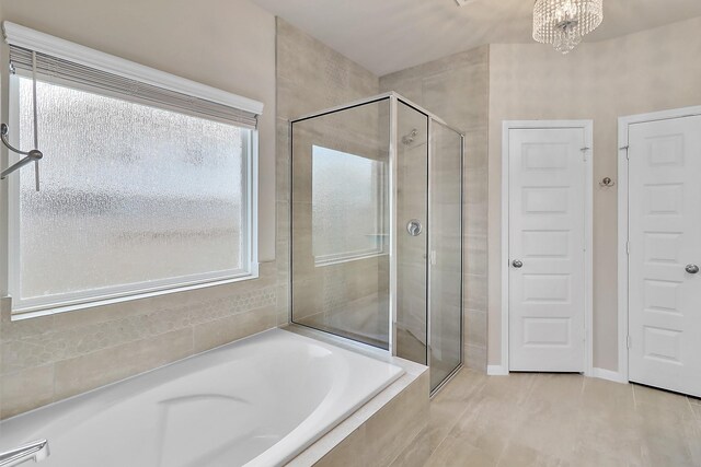 bathroom with tile patterned floors and plus walk in shower