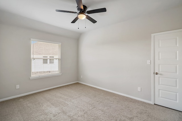 spare room featuring carpet flooring and ceiling fan