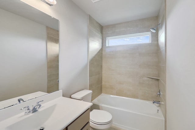 full bathroom featuring toilet, vanity, and tiled shower / bath