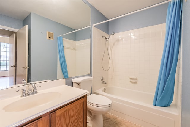 full bathroom featuring tile patterned flooring, toilet, shower / bathtub combination with curtain, and vanity