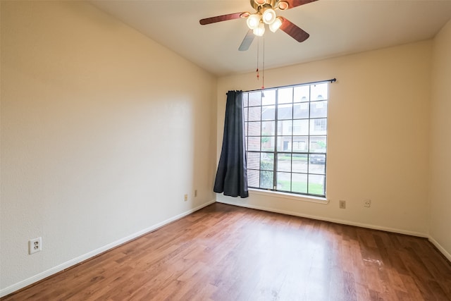 unfurnished room with wood-type flooring and ceiling fan