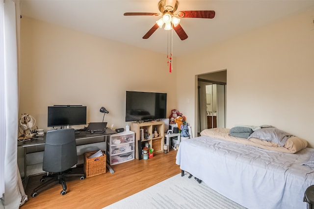 bedroom with ceiling fan and light hardwood / wood-style floors